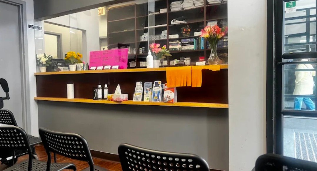 Reception desk and waiting area at Earl Bales Walk-in Clinic, North York